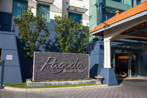 a building with a sign on the front of it at Pagoda Resort & Spa in Perth