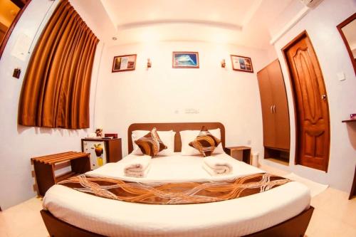 Postel nebo postele na pokoji v ubytování Santa Rosa Maldives