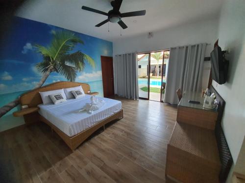 A bed or beds in a room at Blue Planet Panglao