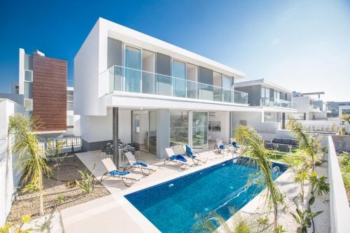 an image of a villa with a swimming pool at Olivine Pearl Villas in Protaras