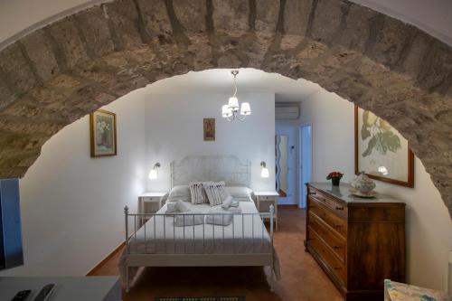 a bedroom with a bed and a dresser in a room at Casa Cimino A in Praiano