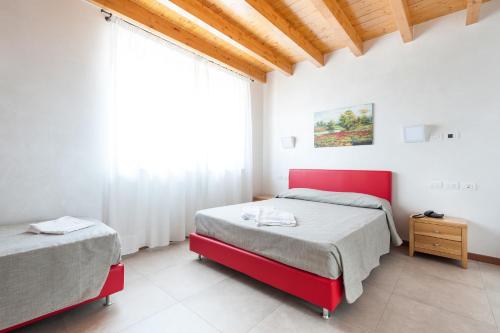Cama o camas de una habitación en Agricampeggio Corte Tonolli
