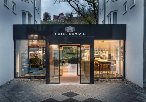 a hotel downwell sign on the front of a building at Domizil Tübingen in Tübingen