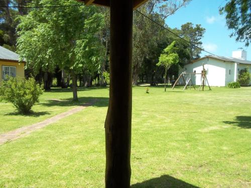a pole in a yard with a playground at La Posada del Mar in Miramar