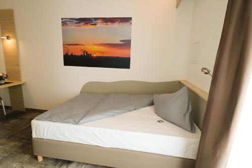Una cama o camas en una habitación de Petul Apart Hotel An'ne 40
