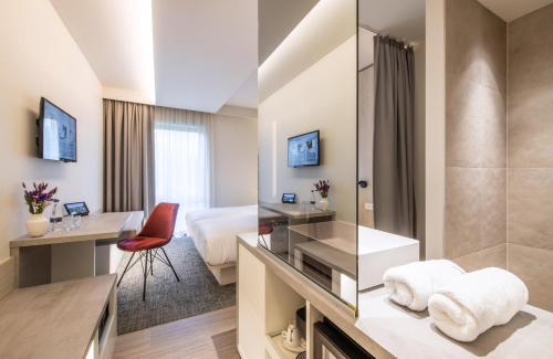 TV a/nebo společenská místnost v ubytování Begijnhof Hotel