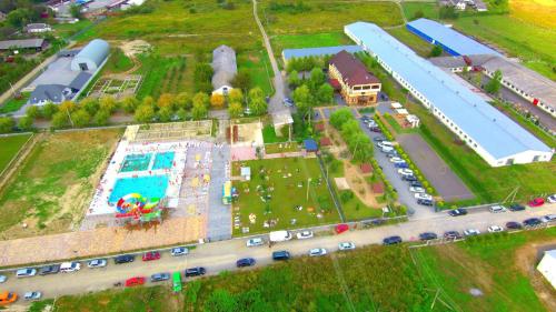 an aerial view of a park with a pool at Tulipan Hotel Aquapark in Vyshkove