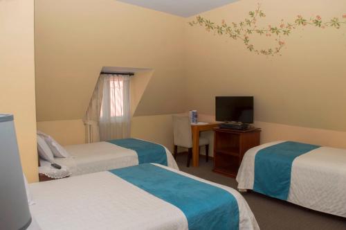 Hotel La Casonaにあるベッド