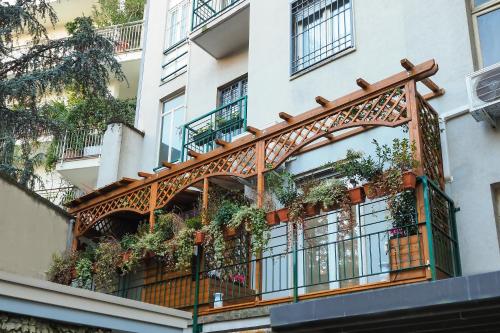 a balcony with plants on the side of a building at Moscova Luxury B&B in Milan