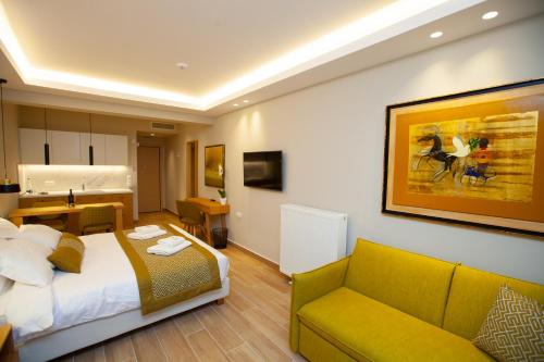 a hotel room with a bed and a couch at No21 Luxury Suites in Thessaloniki
