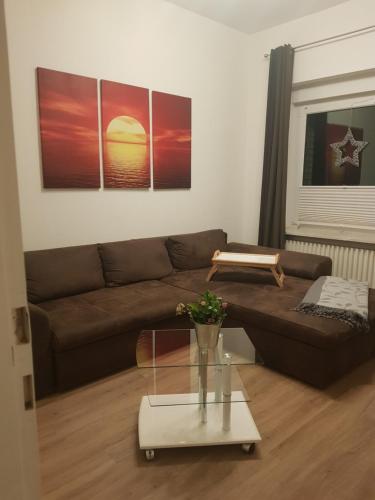 a living room with a couch and a table at Ferienwohnung Peters in Bad Harzburg