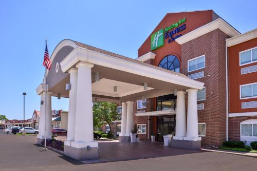 a hotel with a gas station in front of it at Holiday Inn Express Hotel & Suites Elgin by IHG in Elgin