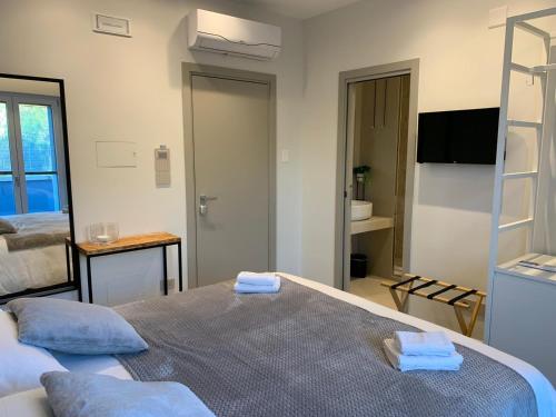 a hotel room with two beds and a television at B&B Dimora Vistamare in Barletta