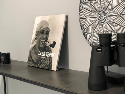 a picture of a man smoking a pipe on a table at Harmony apartment in Mindelo São Vicente in Mindelo