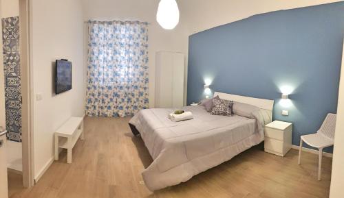 Un pat sau paturi într-o cameră la Dietro il massimo