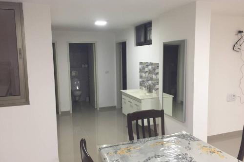 a dining room with a table and a mirror at Wonderful near Ram lake and Hermon mountain in Mas'ade
