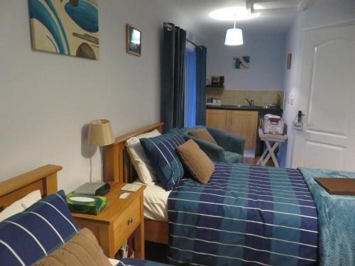 Ένα ή περισσότερα κρεβάτια σε δωμάτιο στο Little Orchard Apartment