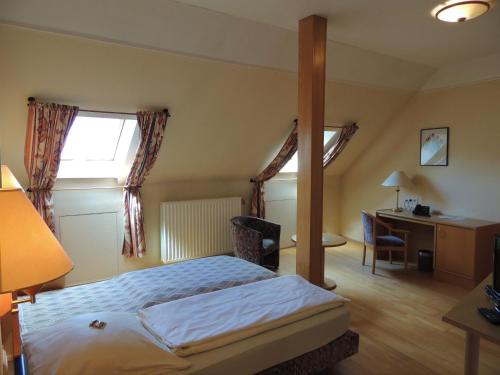 Postel nebo postele na pokoji v ubytování Hotel-Restaurant Zum Onkel Jonathan