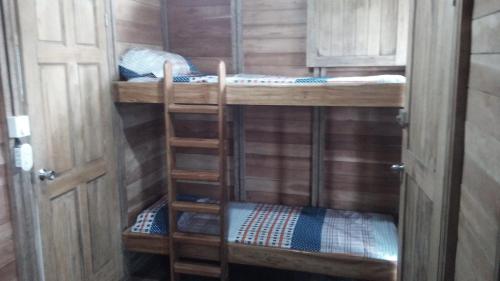 a couple of bunk beds in a room at Finca Sueno de Osa in Puerto Jiménez