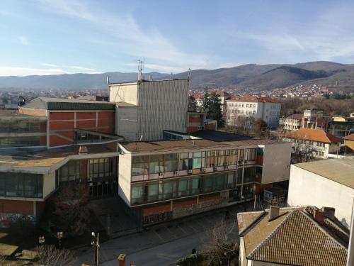 an overhead view of a city with buildings and mountains at Apartman DUNJA in Vranje