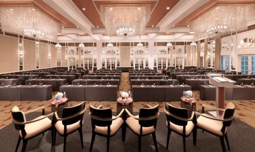 a large banquet hall with tables and chairs at InterContinental Singapore by IHG in Singapore