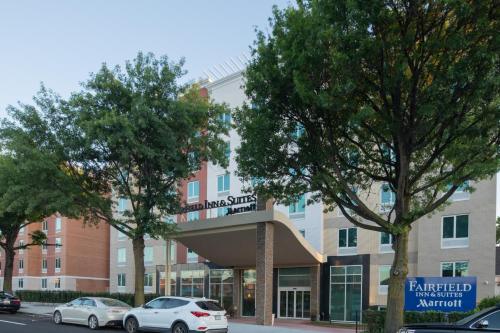 a building with cars parked in front of it at Fairfield Inn & Suites by Marriott New York Queens/Fresh Meadows in Queens