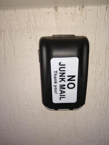 a sign on a wall with the word emergency on it at Hi 5 Victor Harbour Holiday Apartment in Victor Harbor