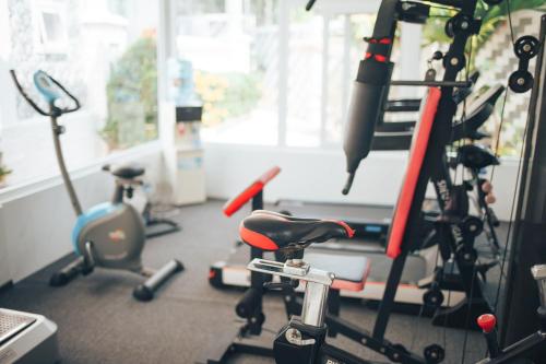 a gym with several exercise bikes and a treadmill at Godiva Villa Phu Quoc in Phu Quoc