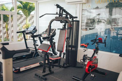 two exercise bikes in a gym with a window at Godiva Villa Phu Quoc in Phu Quoc