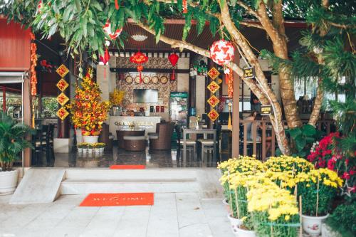 a flower shop with flowers and plants in front of it at Godiva Villa Phu Quoc in Phu Quoc