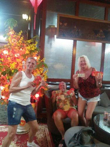a group of people sitting in a living room at Godiva Villa Phu Quoc in Phu Quoc