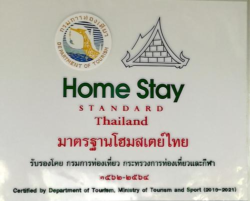 a sign that reads home stay standard thailand at Mr Bao Homestay & Bungalows in Ko Yao Noi