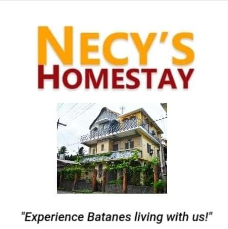 a sign that says keys homesagency with a house at Necy's Homestay in Kāman