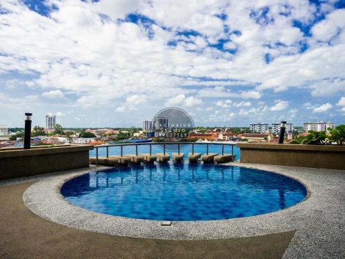 a swimming pool on the roof of a building at Studio Exclusive (D'Perdana Condominium) in Kota Bharu