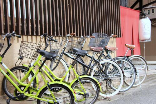 a group of bikes parked next to a building at Guesthouse KYOTO COMPASS in Kyoto