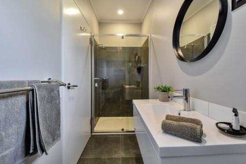 a bathroom with a sink and a shower at Dundee Beach Holiday Park in Dundee Beach