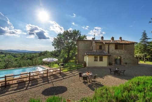an external view of a house and a swimming pool at B&B Country House Poggio Del Drago in Ponticino