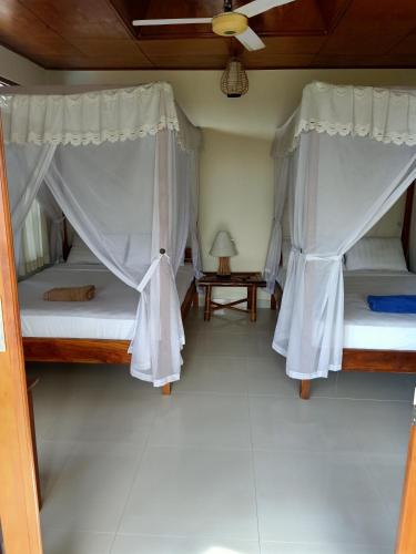 Postel nebo postele na pokoji v ubytování Bamboo Bali