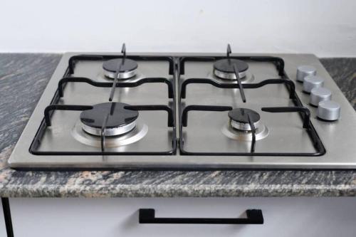 a stove top oven sitting on top of a counter at Amaze Residence luxury 2bedroom apartment 2 in Boralesgamuwa