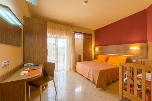 Postel nebo postele na pokoji v ubytování Hotel Palace Magnolia SPA