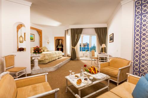 a large living room with a bed and a living room at Hasdrubal Thalassa & Spa Yasmine Hammamet in Hammamet