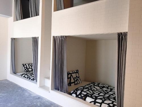 a bunk bed with mirrors in a room at Hostel 1010 TOKYO in Tokyo