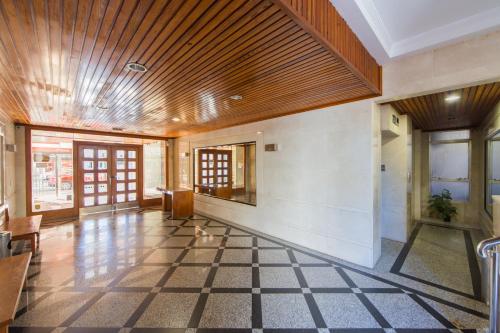a very large room with a lot of windows at Apartamentos Viña del Mar in Benidorm