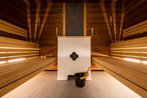 an empty room with an apple sign in the middle at Monaco Sport Hotel in Santo Stefano di Cadore