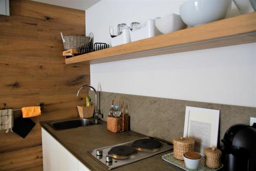 a kitchen with a sink and a counter top at 32 BnB Camerecaffè in Pavia