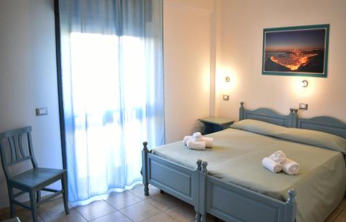 Ένα ή περισσότερα κρεβάτια σε δωμάτιο στο Hotel Residence Ampurias