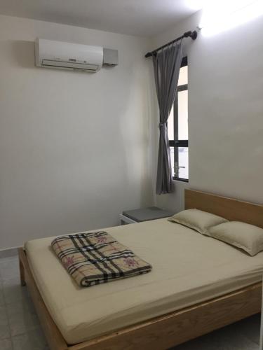 Giường trong phòng chung tại JACY Apartment - Phan Rang, Ninh Thuan