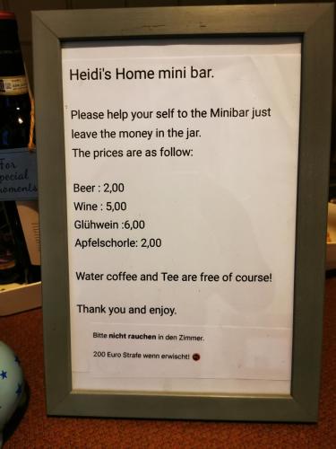 a sign for a mini bar in a frame at Mountain Hideaway in Garmisch-Partenkirchen