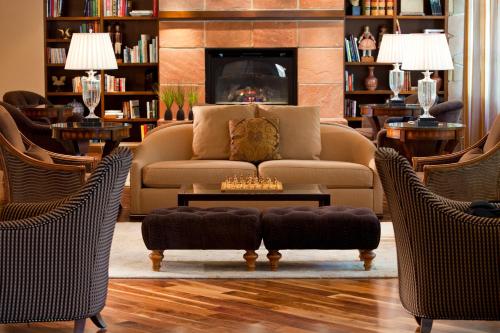 a living room filled with furniture and a fireplace at Warwick Denver in Denver