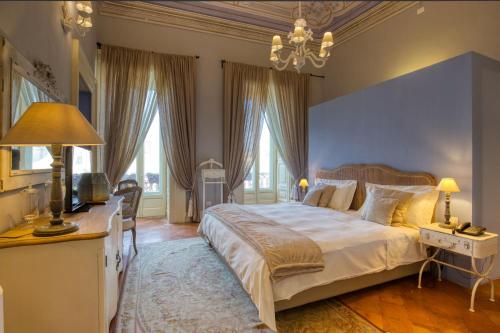 Postel nebo postele na pokoji v ubytování Corte Rossetti Le Dimore Luxury B&B